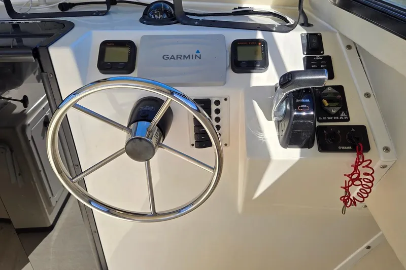 Slide: The Image of Steering console of 2015 May-Craft 2550 Pilot XL with Garmin navigation system. - 21