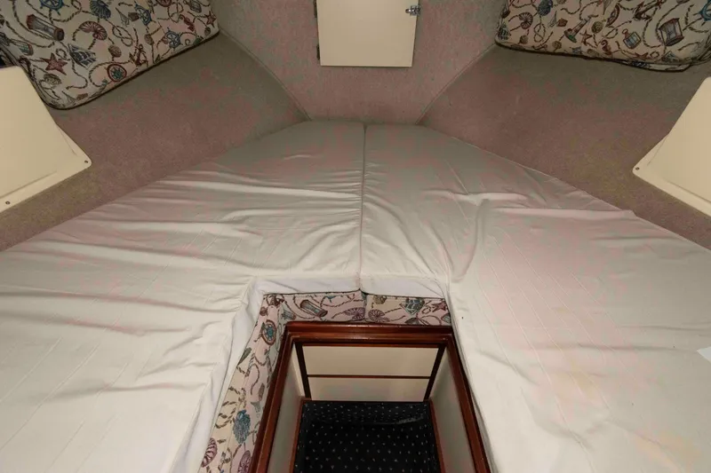 Slide: The Image of Interior cabin of 1999 Camano 31 Troll boat with patterned cushions. - 11