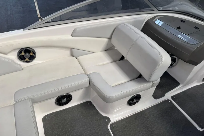 Slide: The Image of 2014 Regal 1900 ES Bowrider interior with white seating and built-in speakers. - 10