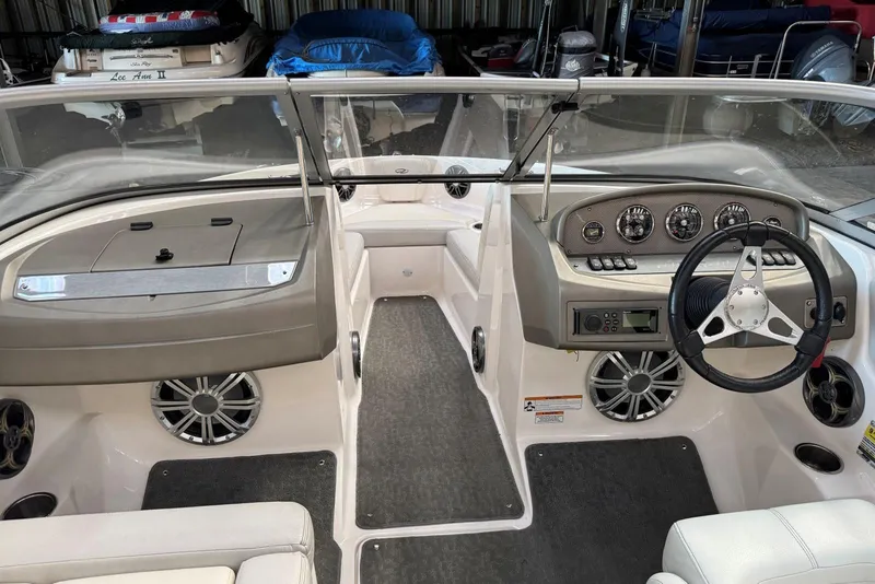 Slide: The Image of 2014 Regal 1900 ES Bowrider interior with steering wheel and dashboard controls. - 14