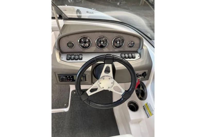 Slide: The Image of 2014 Regal 1900 ES Bowrider dashboard with steering wheel and instrument panel. - 16