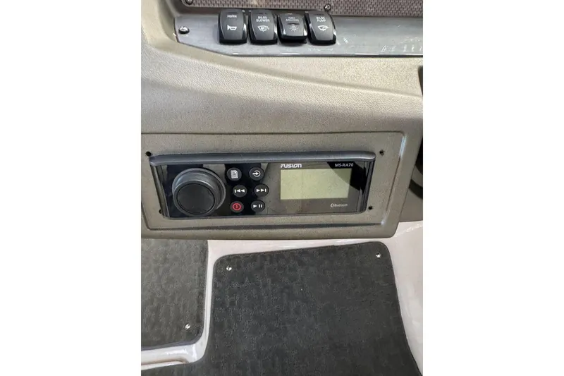 Slide: The Image of Control panel of a 2014 Regal 1900 ES Bowrider boat with Fusion MS-RA70 stereo system. - 17