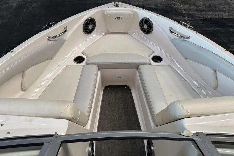 Slide: The Image of 2014 Regal 1900 ES Bowrider interior with white seating and cup holders. - 19