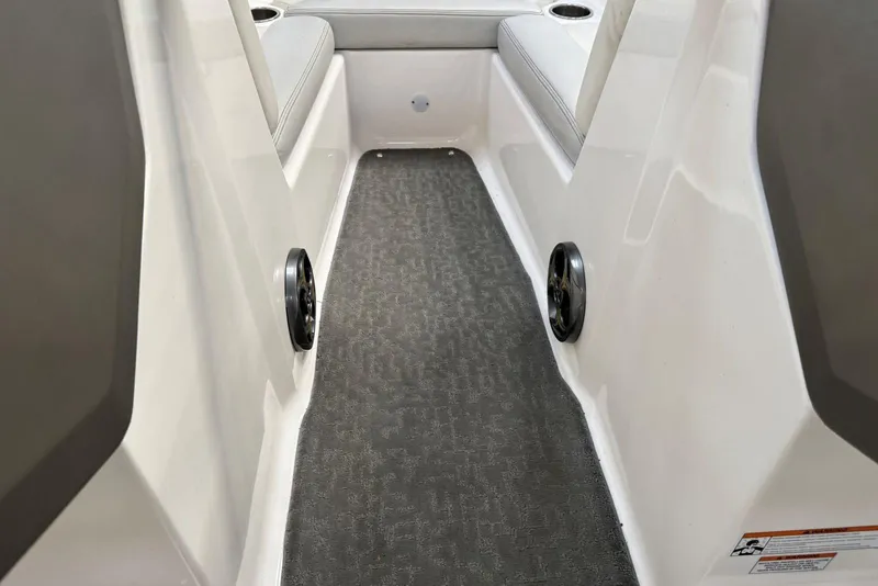 Slide: The Image of 2014 Regal 1900 ES Bowrider interior with gray carpet and seating. - 20