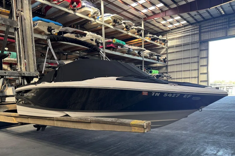 Slide: The Image of 2014 Regal 1900 ES Bowrider in storage, covered and elevated in a warehouse. - 28