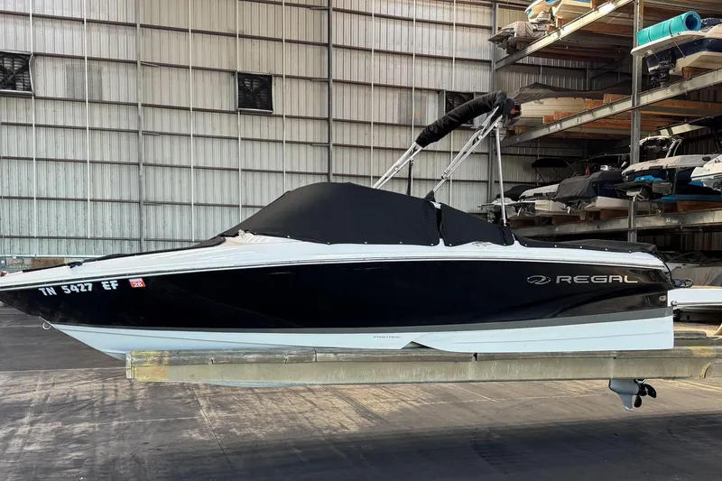 Slide: The Image of 2014 Regal 1900 ES Bowrider boat in storage, black and white design. - 29