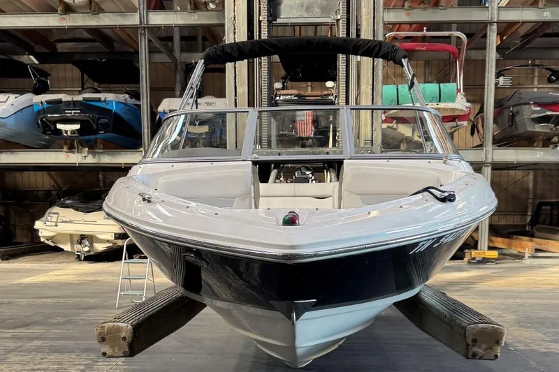 Slide: The Image of 2014 Regal 1900 ES Bowrider boat in storage, front view, indoors. - 3