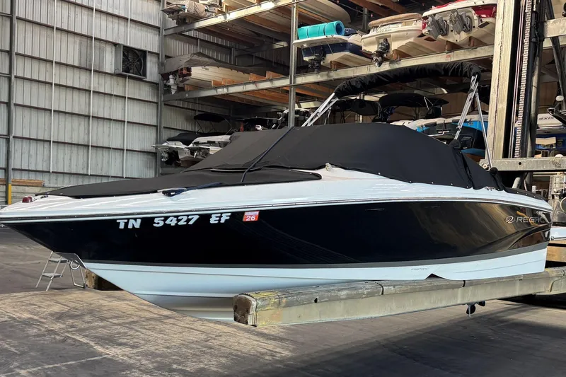 Slide: The Image of 2014 Regal 1900 ES Bowrider boat in storage, covered and elevated indoors. - 30