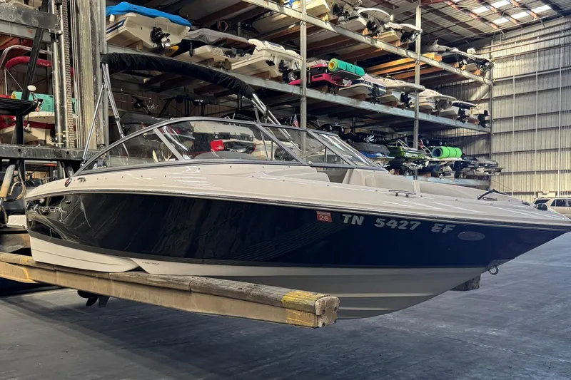 Slide: The Image of 2014 Regal 1900 ES Bowrider in storage, showcasing sleek design and modern features. - 4