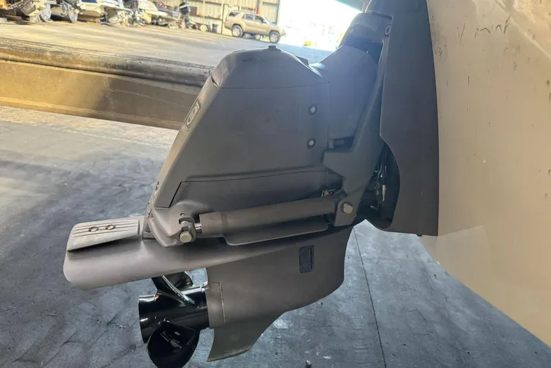 Slide: The Image of 2014 Regal 1900 ES Bowrider boat outdrive, close-up view in a workshop setting. - 5