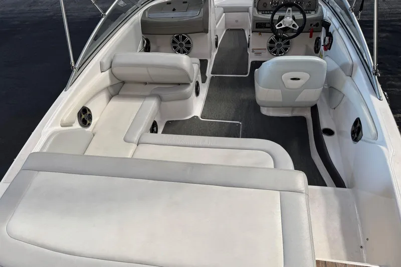 Slide: The Image of 2014 Regal 1900 ES Bowrider interior with plush seating and modern dashboard. - 8