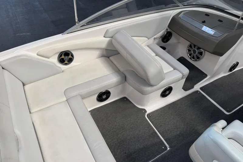 Slide: The Image of 2014 Regal 1900 ES Bowrider interior with white seating and built-in speakers. - 9