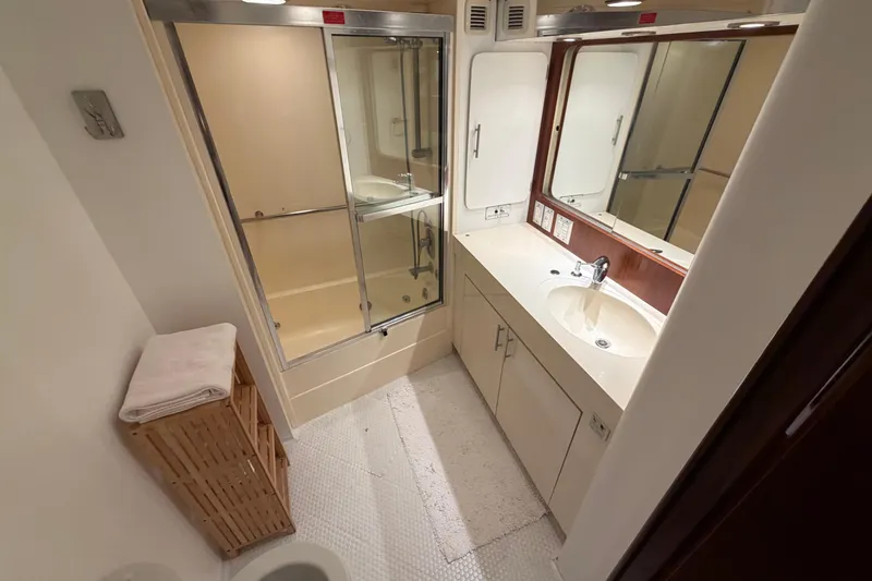Slide: The Image of Bathroom interior of 1991 Hatteras 70 Motor Yacht with shower and vanity. - 104