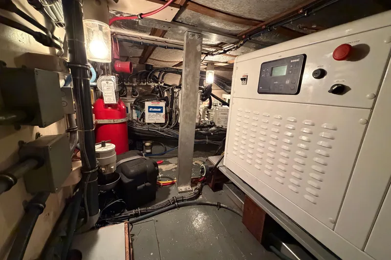 Slide: The Image of Engine room of 1991 Hatteras 70 Motor Yacht with generator and equipment. - 117