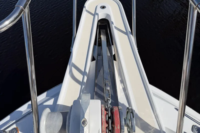 Slide: The Image of Bow view of 1991 Hatteras 70 Motor Yacht with anchor chain and railing. - 21