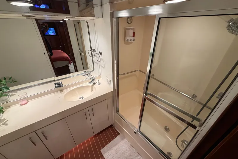 Slide: The Image of Bathroom interior of 1991 Hatteras 70 Motor Yacht with shower and vanity. - 78