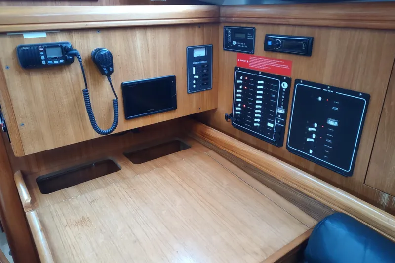 Slide: The Image of Control panel of a 2003 Hunter 356 sailboat with communication equipment. - 36