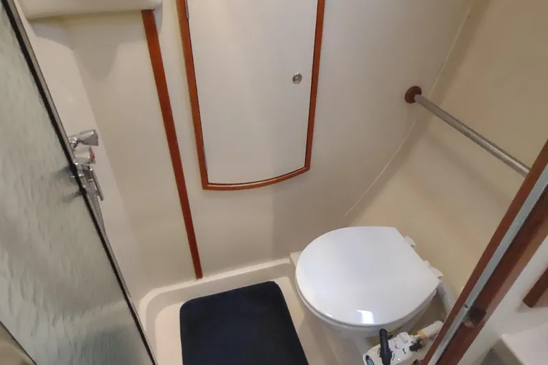 Slide: The Image of Compact bathroom in 2003 Hunter 356 yacht with shower and toilet. - 40