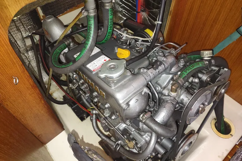 Slide: The Image of Engine of a 2003 Hunter 356 sailboat, showcasing detailed mechanical components. - 46