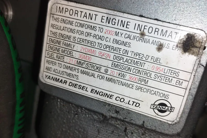 Slide: The Image of Engine information label on a 2003 Hunter 356, Yanmar diesel specifications. - 47
