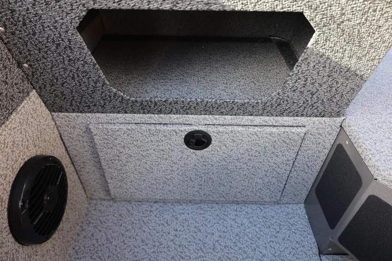 Slide: The Image of Interior storage compartment of 2026 Lund 1875 Impact XS Sport boat. - 24