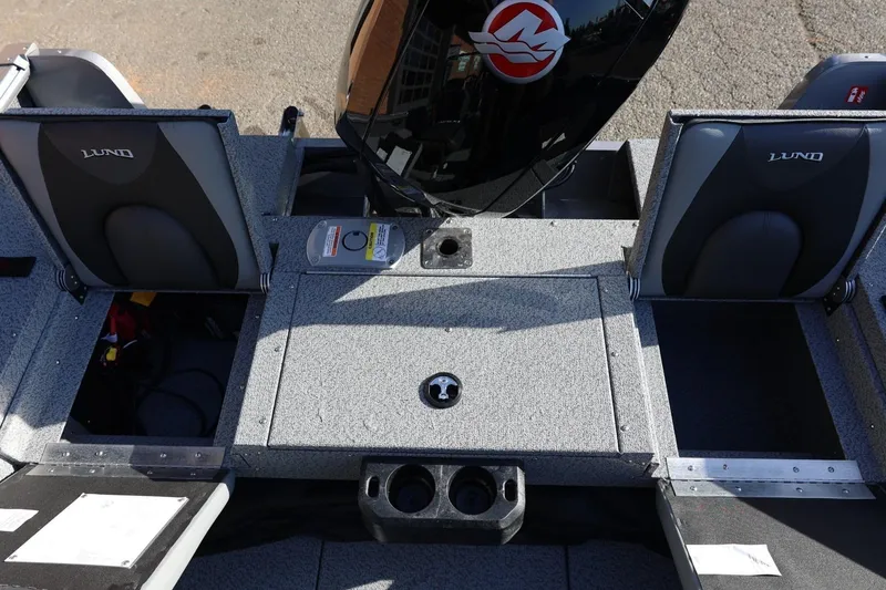 Slide: The Image of 2026 Lund 1875 Impact XS Sport boat interior with seating and storage compartments. - 31