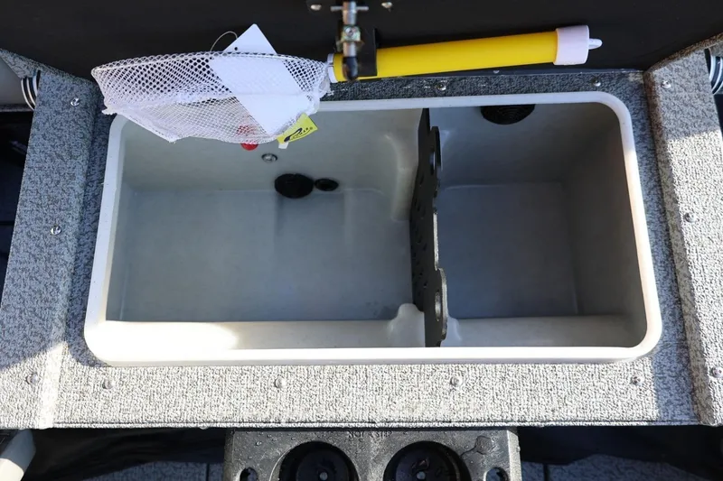 Slide: The Image of 2026 Lund 1875 Impact XS Sport boat livewell with divider and netting. - 32