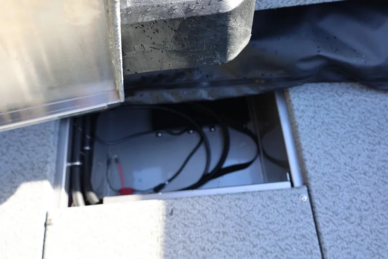 Slide: The Image of Open storage compartment in 2026 Lund 1875 Impact XS Sport boat. - 33