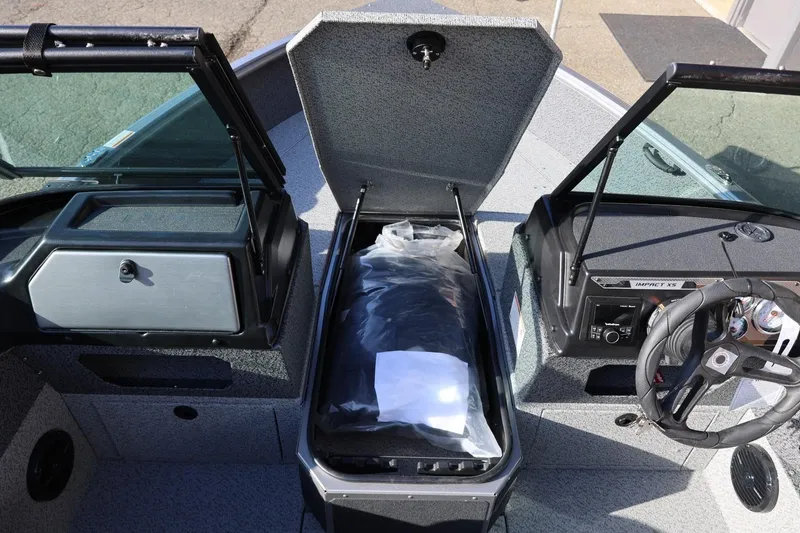 Slide: The Image of 2026 Lund 1875 Impact XS Sport boat interior with open storage compartment. - 35