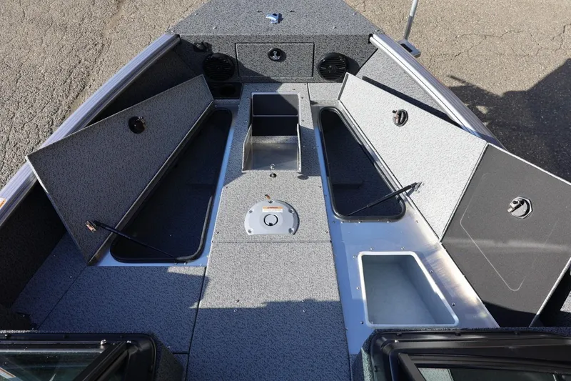 Slide: The Image of 2026 Lund 1875 Impact XS Sport boat interior with open storage compartments. - 36