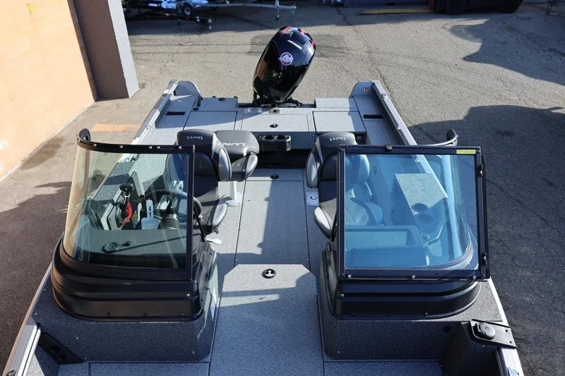 Slide: The Image of 2026 Lund 1875 Impact XS Sport boat with dual windshields and seating, viewed from above. - 38