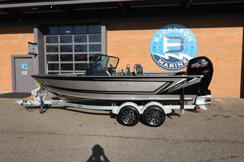 Slide: The Image of 2026 Lund 1875 Impact XS Sport boat on trailer at Bjornson Marine. - 40