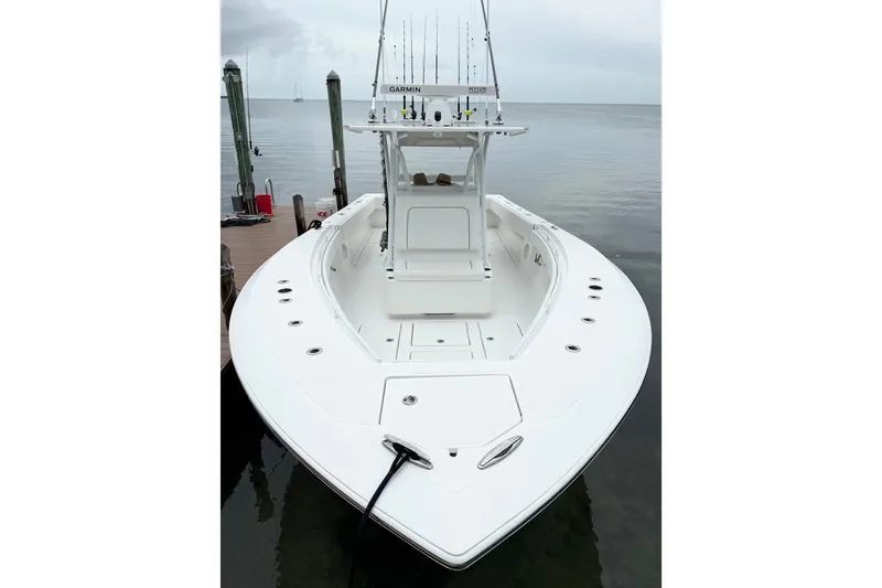 Slide: The Image of 2022 SeaHunter 33 Tournament boat docked, featuring spacious deck and advanced navigation equipment. - 11