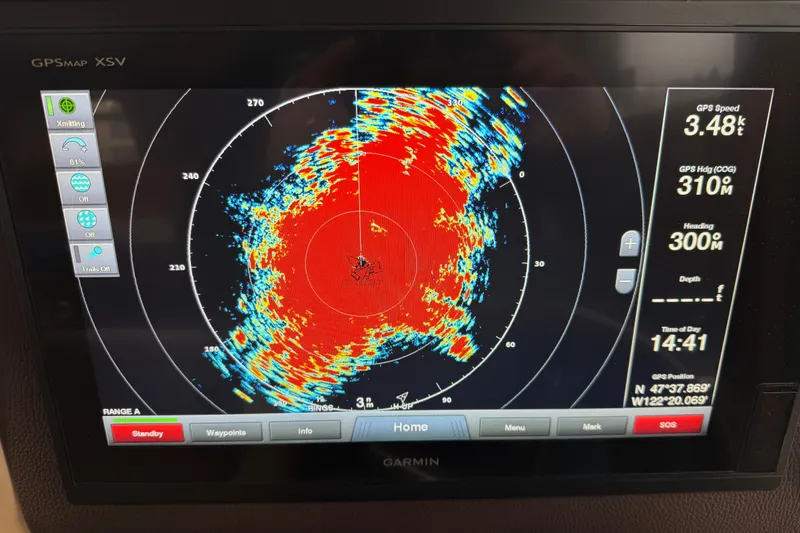 Slide: The Image of Garmin GPS display on 2017 Ranger Tugs R-31 CB, showing radar and navigation data. - 12