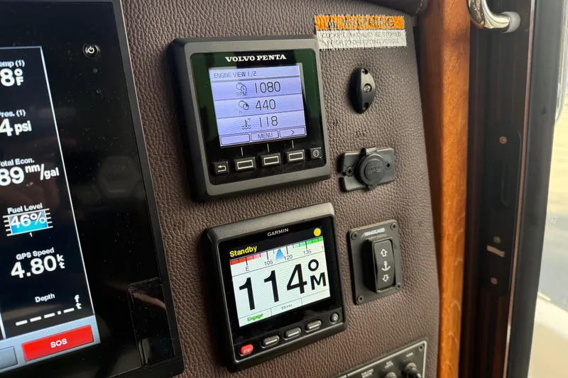 Slide: The Image of Control panel of 2017 Ranger Tugs R-31 CB with Volvo Penta and Garmin displays. - 14