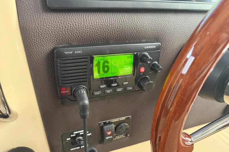 Slide: The Image of Garmin VHF 200 radio on 2017 Ranger Tugs R-31 CB boat dashboard. - 15