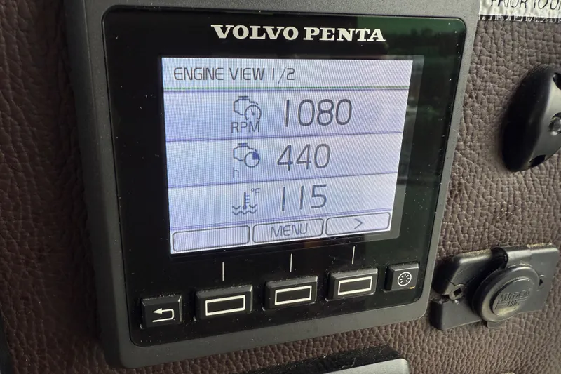 Slide: The Image of Volvo Penta engine display on 2017 Ranger Tugs R-31 CB showing RPM, hours, and temperature. - 16