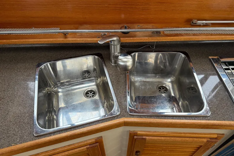 Slide: The Image of Stainless steel double sink in 2017 Ranger Tugs R-31 CB boat kitchen. - 31