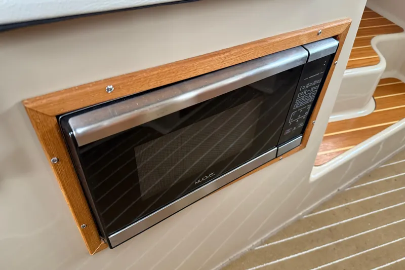 Slide: The Image of Built-in microwave in 2017 Ranger Tugs R-31 CB boat interior. - 37