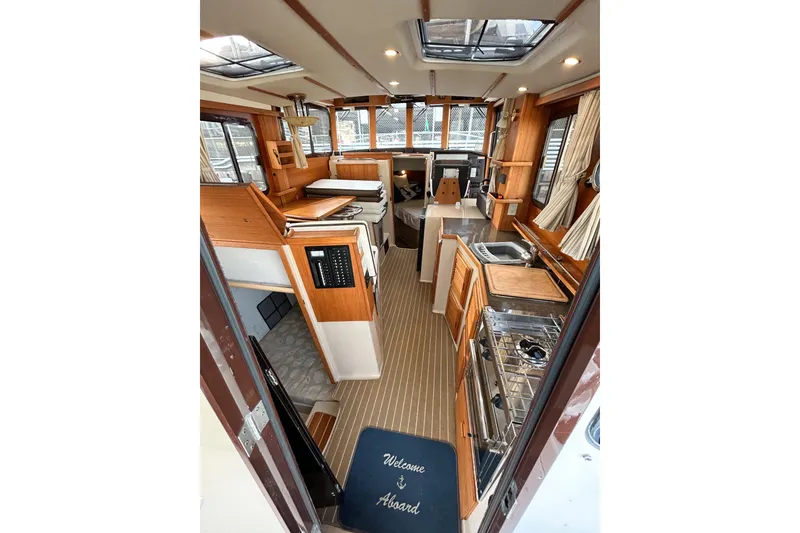 Slide: The Image of Interior of 2017 Ranger Tugs R-31 CB boat with wood finish and modern amenities. - 4