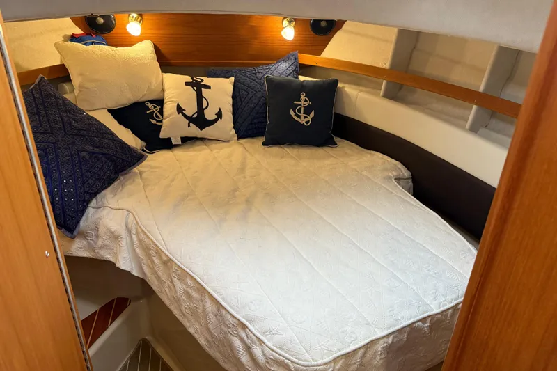 Slide: The Image of Cozy cabin interior of 2017 Ranger Tugs R-31 CB with nautical-themed pillows. - 41