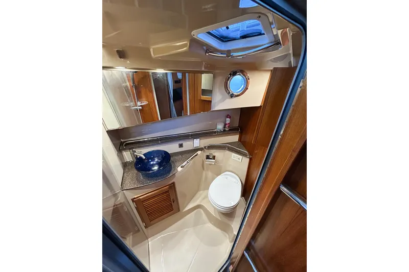 Slide: The Image of Luxurious bathroom in 2017 Ranger Tugs R-31 CB with modern fixtures and porthole window. - 47