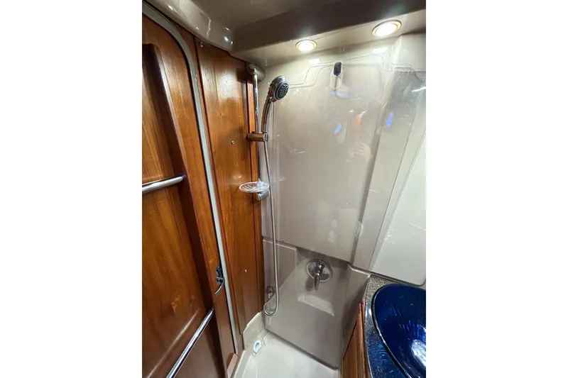 Slide: The Image of 2017 Ranger Tugs R-31 CB bathroom with shower and wooden accents. - 48