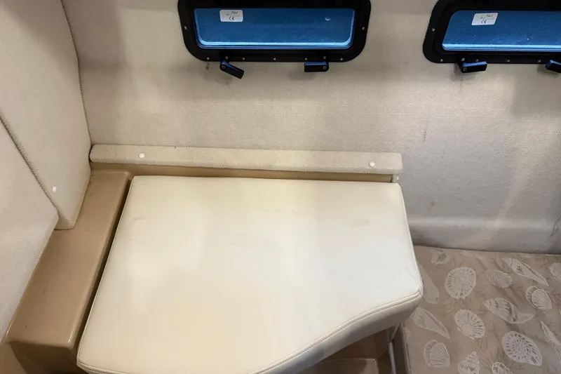 Slide: The Image of 2017 Ranger Tugs R-31 CB interior seating with windows and patterned flooring. - 51