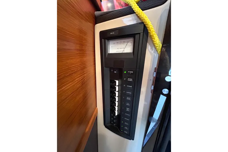 Slide: The Image of Electrical panel on 2017 Ranger Tugs R-31 CB boat, featuring AC voltage meter. - 59