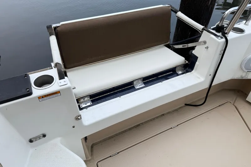 Slide: The Image of 2017 Ranger Tugs R-31 CB boat seating area with cup holder and cushion. - 64
