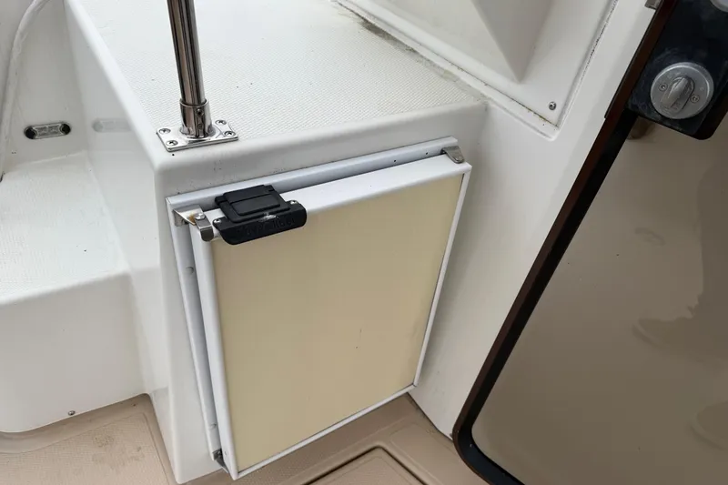 Slide: The Image of 2017 Ranger Tugs R-31 CB boat interior detail with storage compartment and railing. - 70