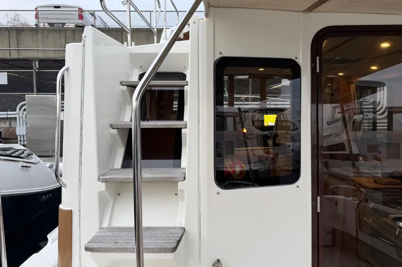 Slide: The Image of 2017 Ranger Tugs R-31 CB boat with exterior stairs and cabin entrance. - 71
