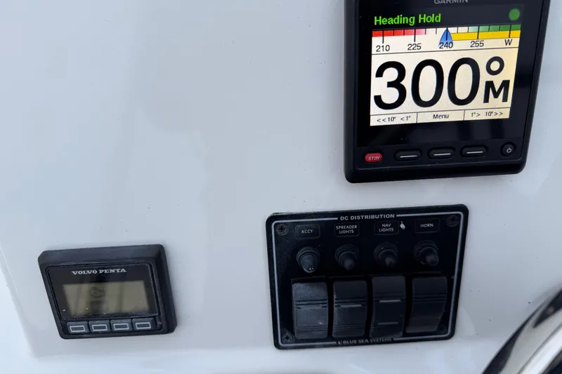 Slide: The Image of Control panel of 2017 Ranger Tugs R-31 CB with Garmin and Volvo Penta displays. - 75