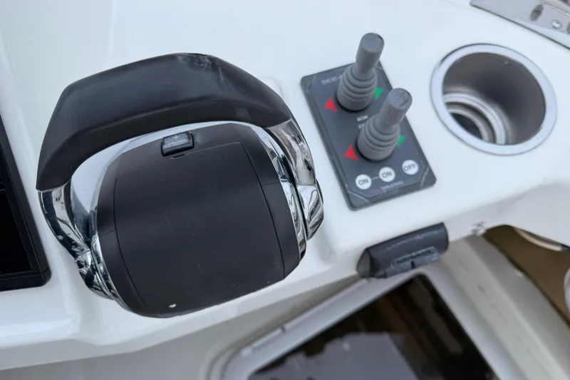 Slide: The Image of Control panel of 2017 Ranger Tugs R-31 CB boat with throttle and joystick. - 76